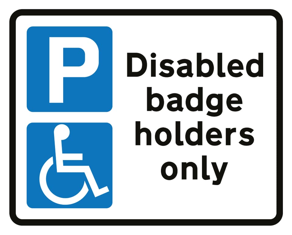 Example parking sign with a wheelchair symbol and Disabled badge holders only wording
