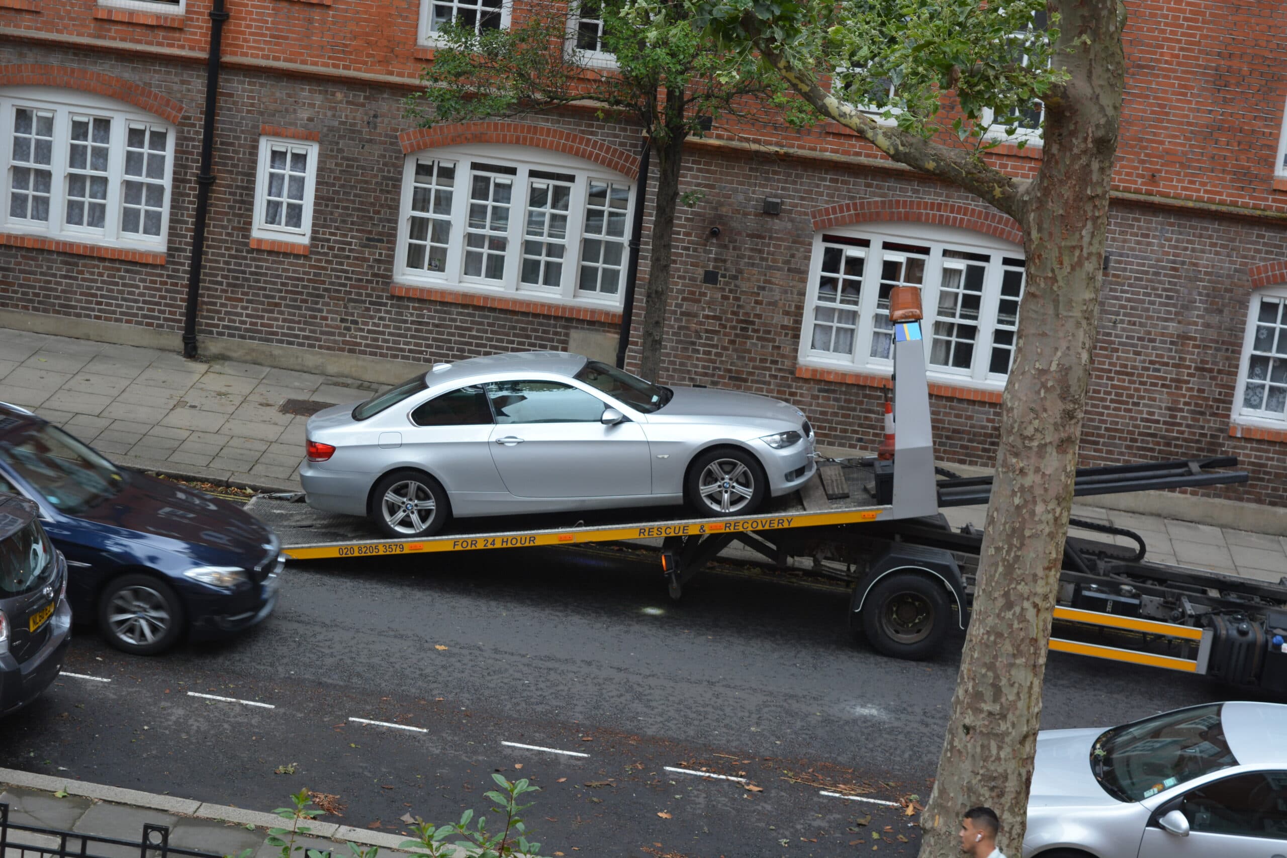 Leo's BMW being taken away during the parking enforcement case that inspired Parking Mate UK